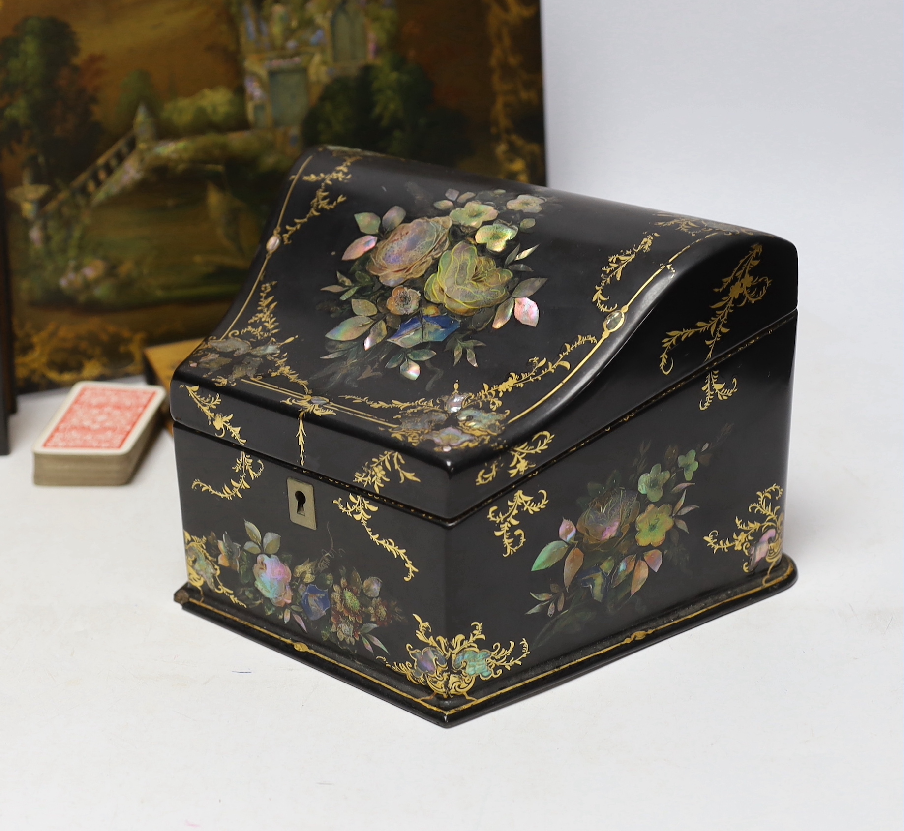 A Victorian papier maché blotter pad, and stationery box and two ebonised treen boxes